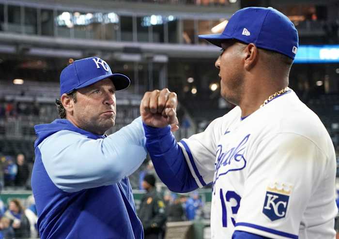 Apr 19, 2022; Kansas City, Missouri, USA; Kansas City Royals manager Mike Matheny (22) celebrates with designated hitter Salvador Perez (13) after the win over the Minnesota Twins at Kauffman Stadium. Mandatory Credit: Denny Medley-USA TODAY Sports